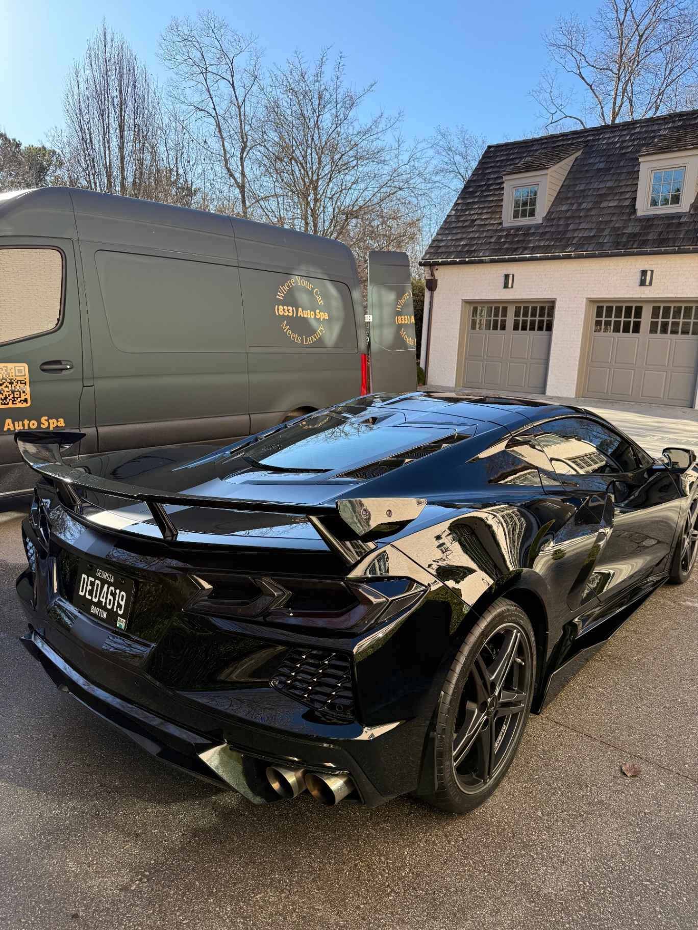 Black Corvette panel showing a clean, defect-free reflection